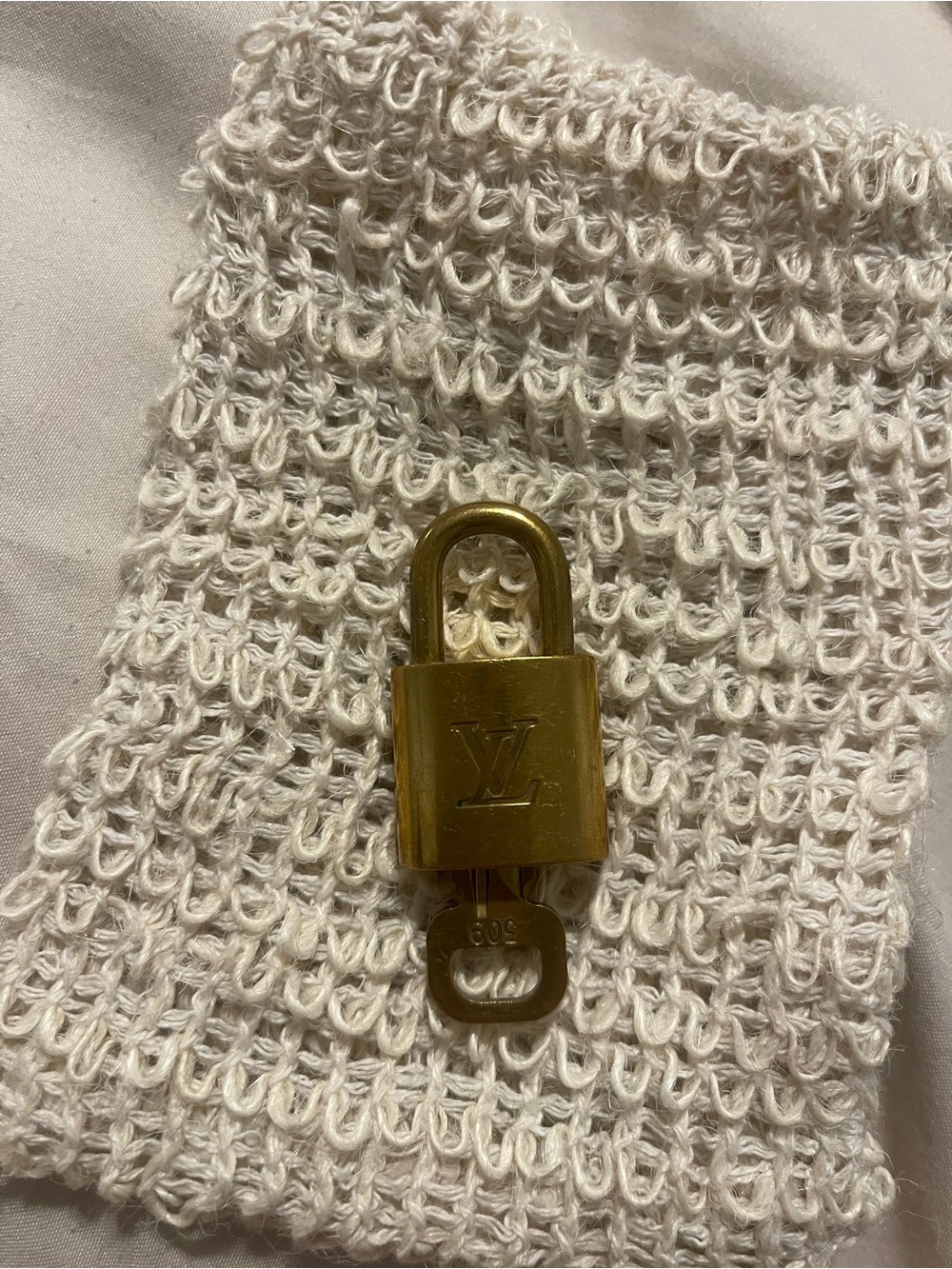 Louis Vuitton Gold-Tone Padlock and Key 
309